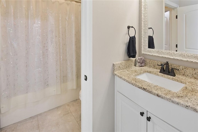 bathroom featuring toilet, tile patterned flooring, vanity, and shower / bathtub combination with curtain