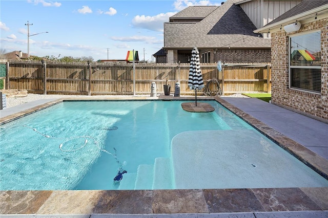 view of swimming pool featuring fence and a fenced in pool