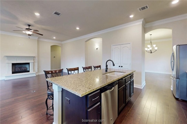 kitchen with a breakfast bar, visible vents, appliances with stainless steel finishes, and a sink