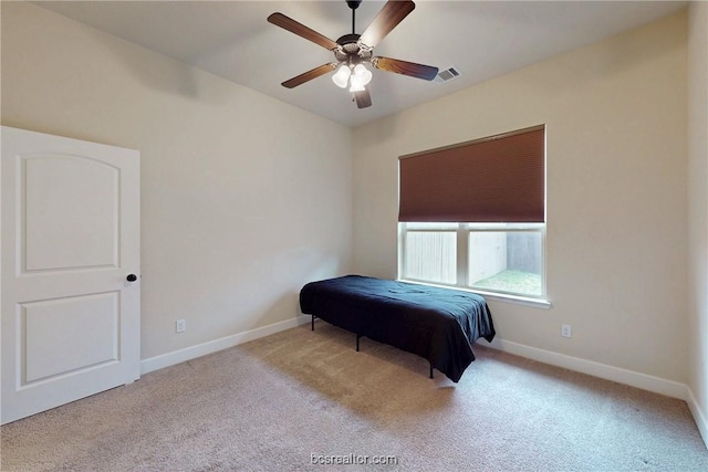 bedroom featuring ceiling fan, baseboards, and carpet floors