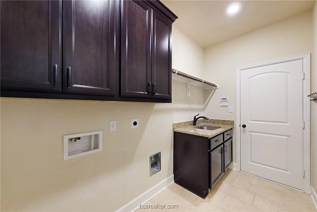 laundry area with hookup for a washing machine, baseboards, hookup for an electric dryer, cabinet space, and a sink