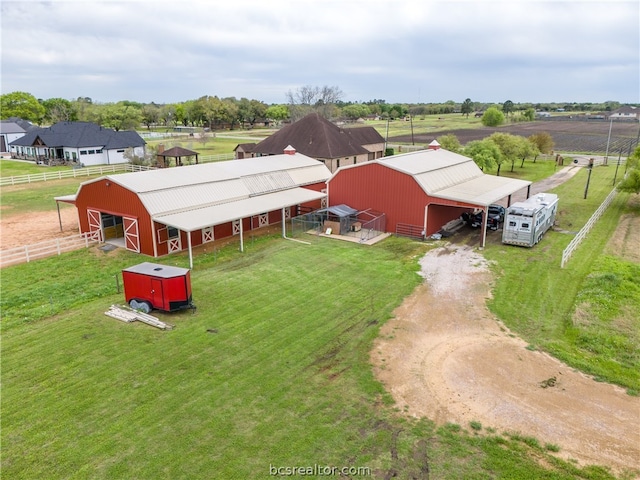 birds eye view of property featuring a rural view