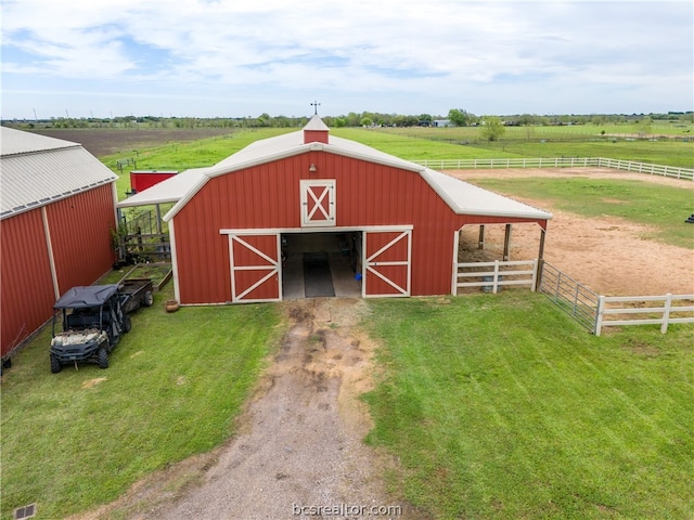 view of outdoor structure with a rural view