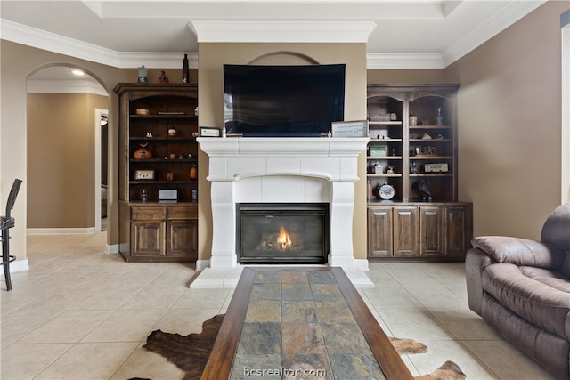 living room featuring a fireplace, light tile patterned floors, and crown molding