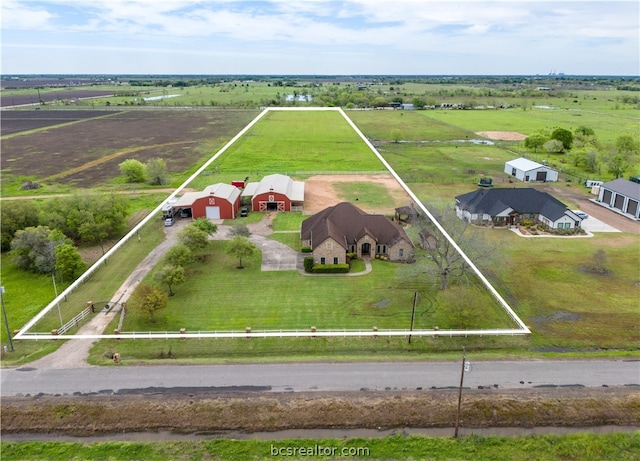 birds eye view of property featuring a rural view