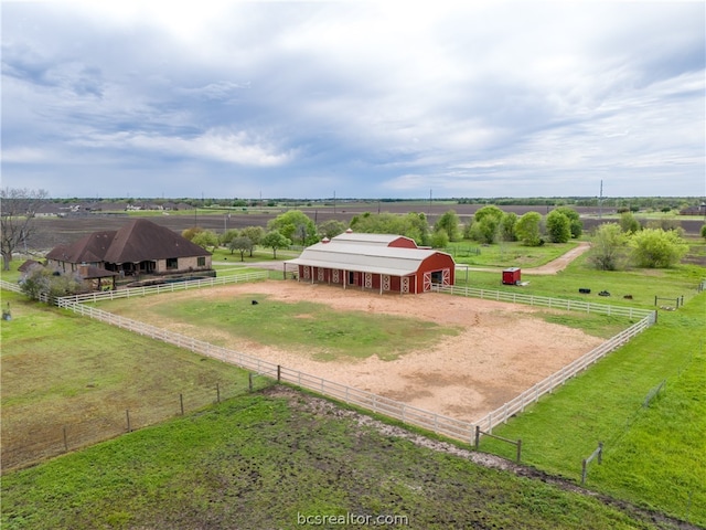 birds eye view of property featuring a rural view