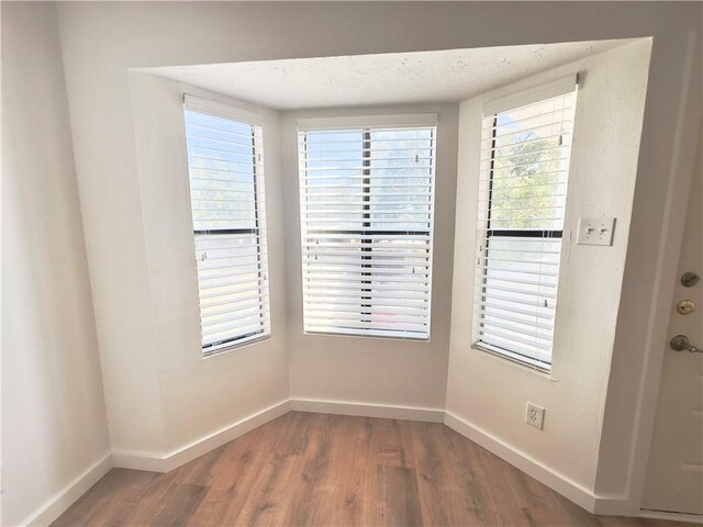 spare room featuring hardwood / wood-style floors