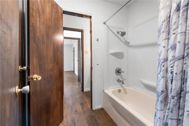 bathroom with shower / bath combo and hardwood / wood-style flooring