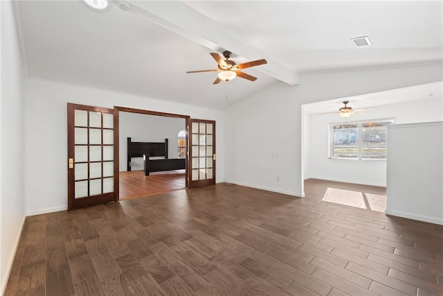 unfurnished living room featuring vaulted ceiling with beams, dark hardwood / wood-style floors, and french doors