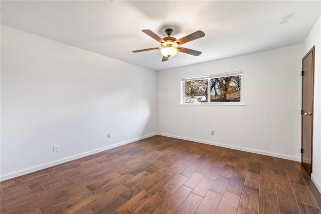 unfurnished room featuring ceiling fan and dark hardwood / wood-style flooring