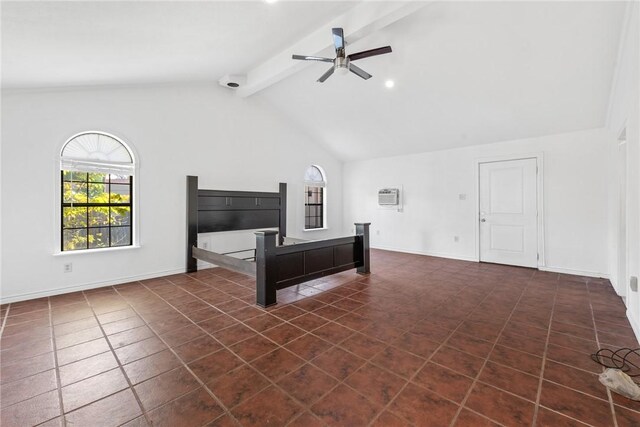 unfurnished bedroom featuring ceiling fan, beamed ceiling, and dark tile patterned flooring