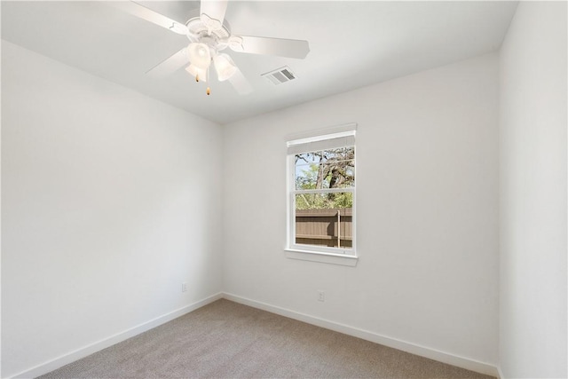 unfurnished room featuring ceiling fan and light colored carpet