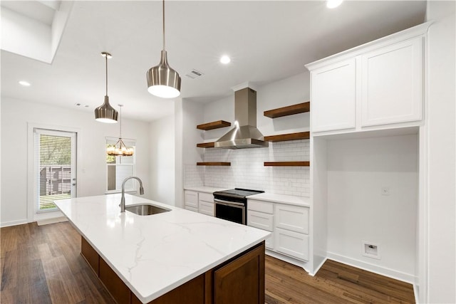 kitchen featuring pendant lighting, range hood, white cabinetry, light stone countertops, and stainless steel electric range