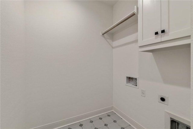 washroom featuring washer hookup, cabinets, and hookup for an electric dryer