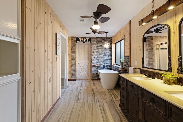 bathroom featuring vanity, wood-type flooring, independent shower and bath, and wood walls