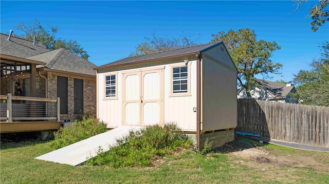 view of outbuilding featuring a lawn