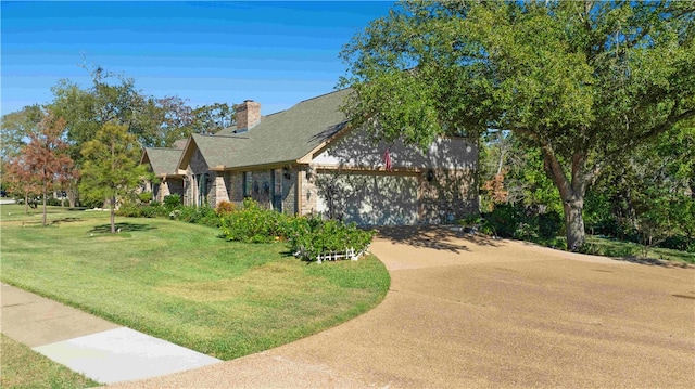 view of front of property featuring a front lawn and a garage