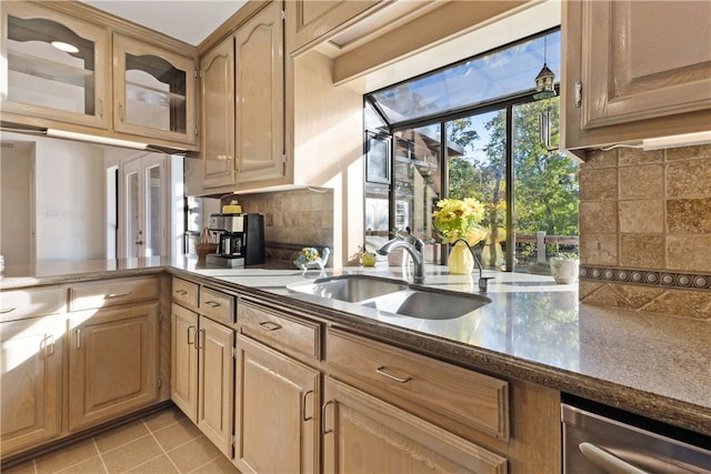 kitchen featuring light tile patterned floors, decorative backsplash, sink, and light brown cabinets