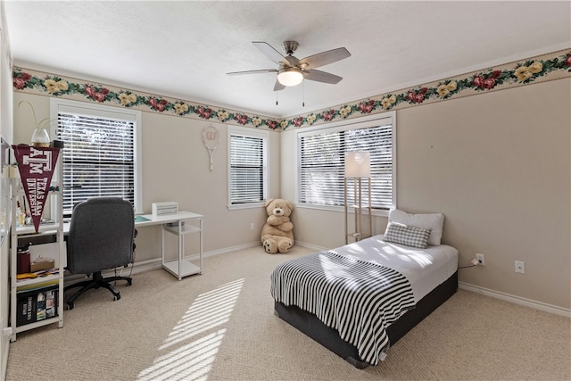 bedroom featuring ceiling fan and light colored carpet