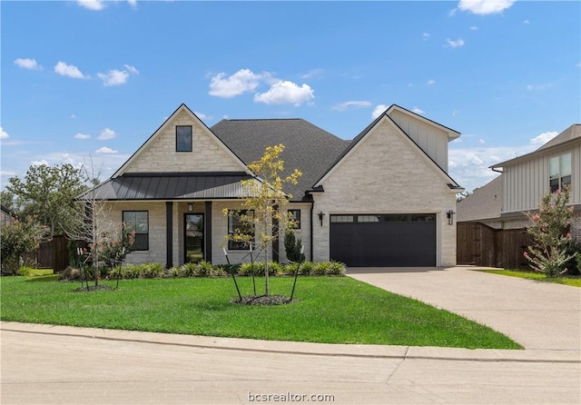 view of front facade with a front yard and a garage