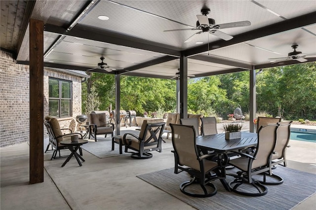 view of patio with outdoor lounge area, an outdoor pool, outdoor dining space, and a ceiling fan