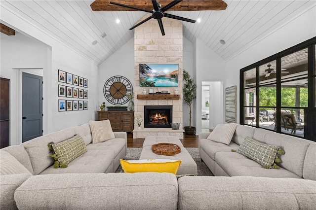 living room with high vaulted ceiling, a fireplace, ceiling fan, and wood finished floors
