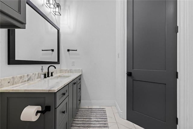 bathroom featuring baseboards and vanity