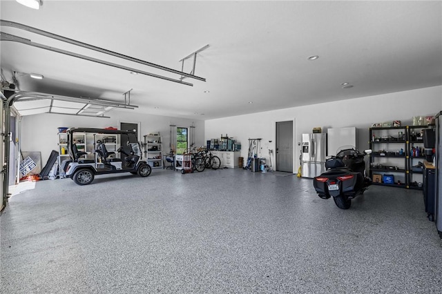 garage featuring stainless steel fridge