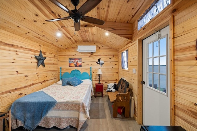 bedroom with wooden ceiling, wood finished floors, a wall unit AC, wood walls, and lofted ceiling