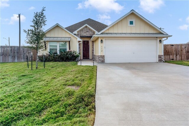 single story home featuring a front yard and a garage