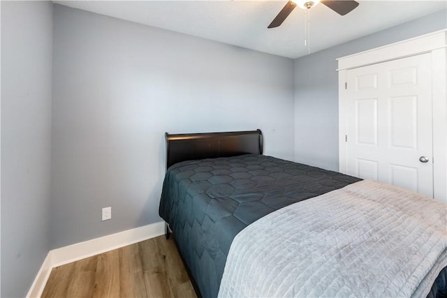 bedroom featuring ceiling fan and hardwood / wood-style floors