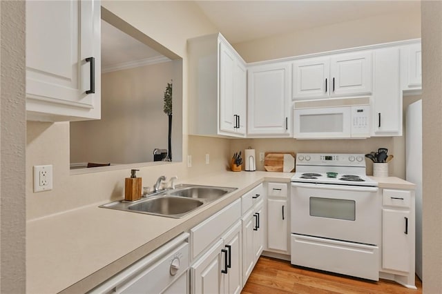 kitchen featuring light wood-type flooring, ornamental molding, white appliances, sink, and white cabinetry