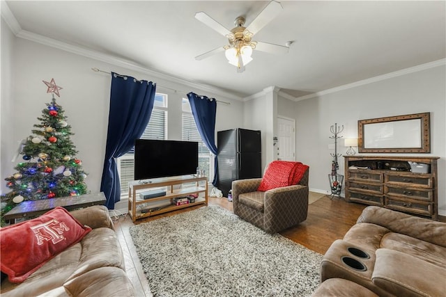 living room featuring hardwood / wood-style flooring, ceiling fan, and ornamental molding