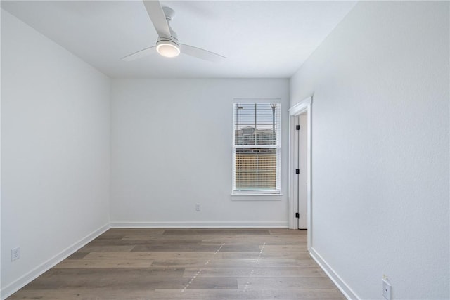 spare room featuring ceiling fan and light wood-type flooring