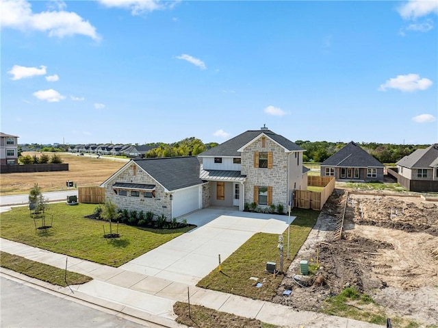 view of front of house with a front lawn and a garage