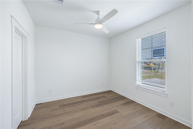 spare room with ceiling fan and hardwood / wood-style floors