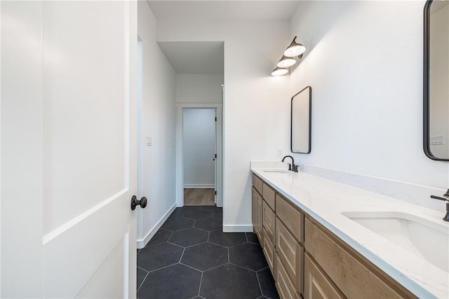 bathroom with tile patterned flooring and vanity