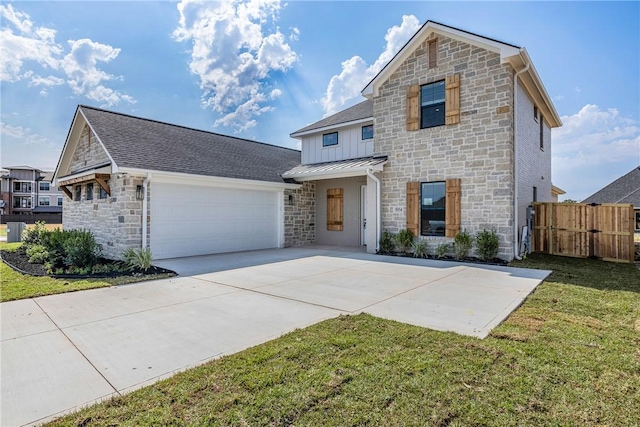 front of property featuring a garage and a front lawn