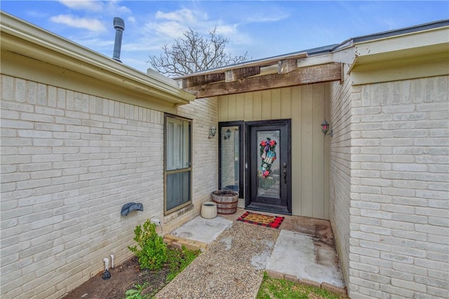 property entrance with brick siding