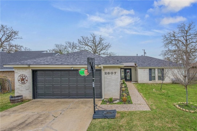 ranch-style house featuring a shingled roof, brick siding, an attached garage, and a front lawn