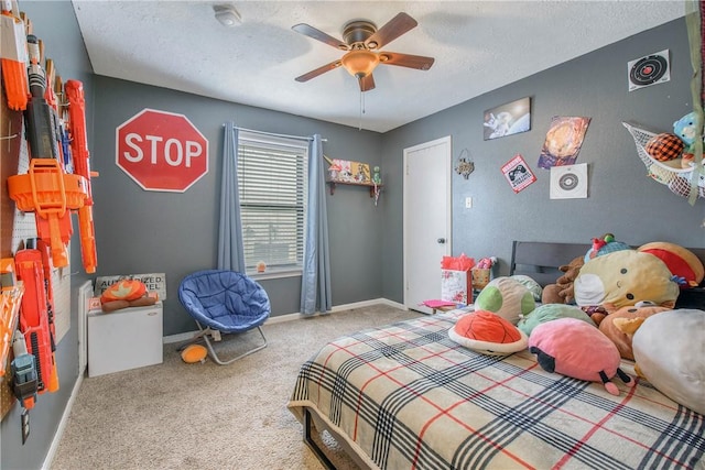 bedroom featuring visible vents, baseboards, a ceiling fan, a textured ceiling, and carpet floors