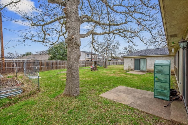 view of yard with a patio area and a fenced backyard