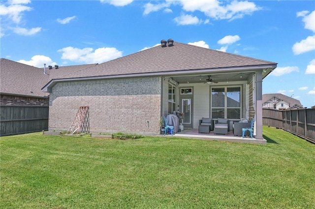 back of house featuring an outdoor hangout area, ceiling fan, a yard, and a patio