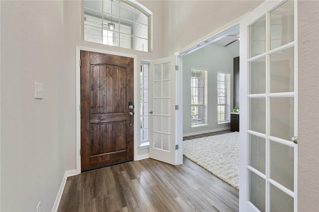 entrance foyer featuring hardwood / wood-style floors and french doors