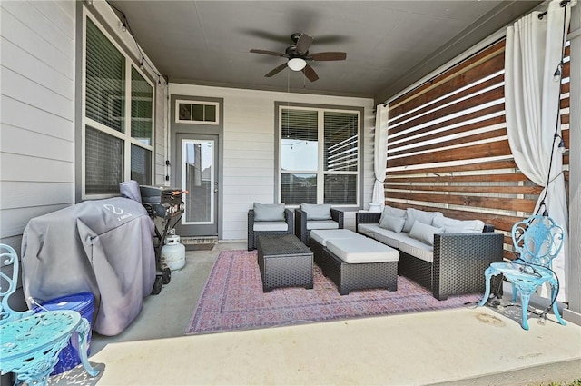 view of patio with ceiling fan and an outdoor living space