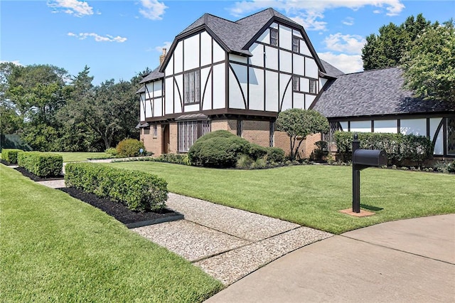 view of side of property with a yard