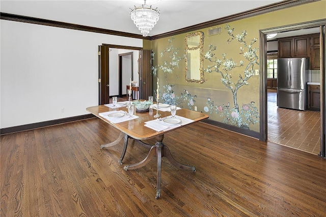 unfurnished dining area with a chandelier, hardwood / wood-style flooring, and crown molding