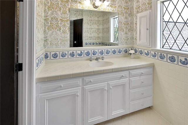 bathroom with plenty of natural light and vanity