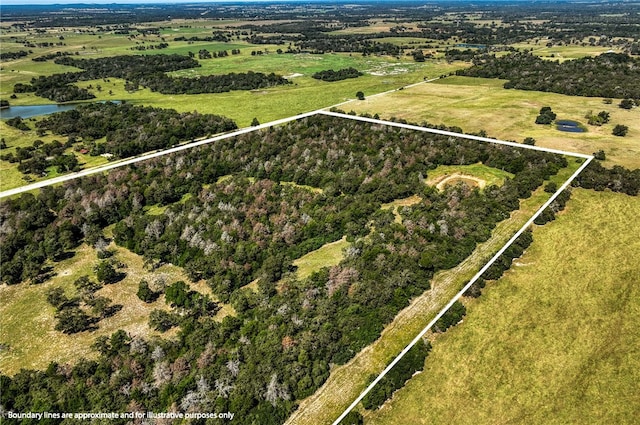 birds eye view of property with a rural view