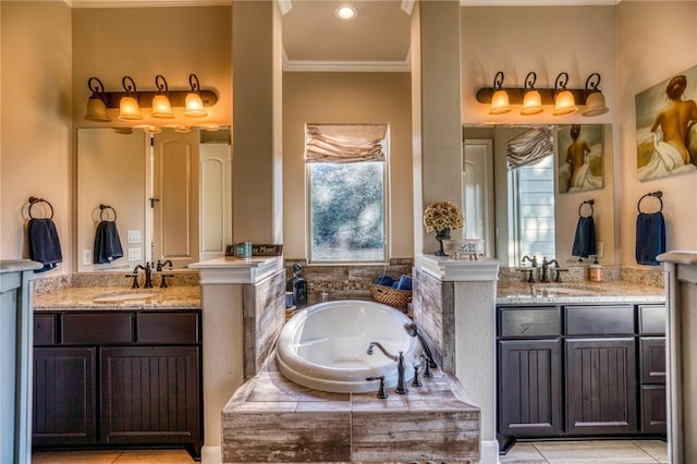 bathroom with tile patterned flooring, vanity, a relaxing tiled tub, and ornamental molding